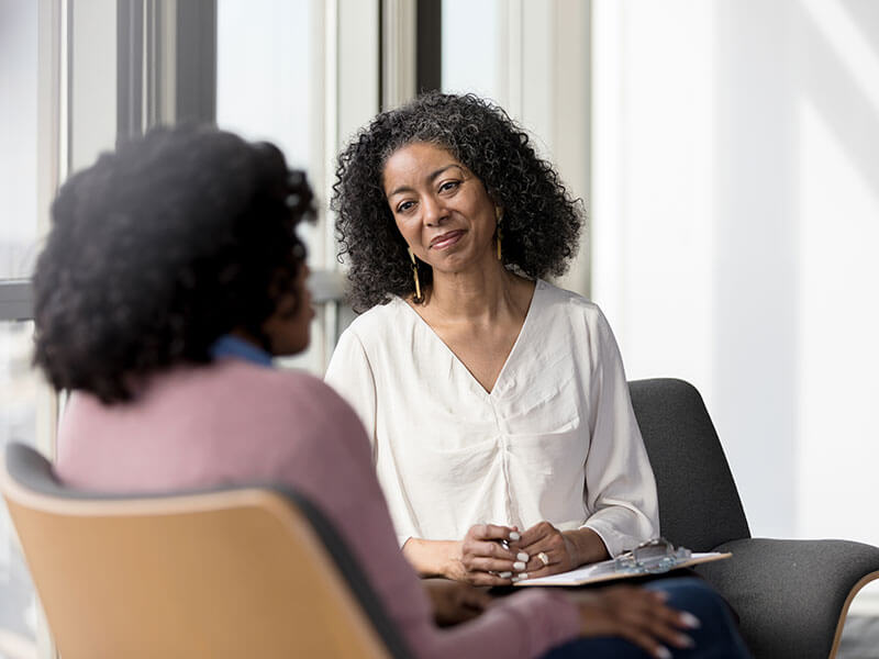 account manager talking to woman
