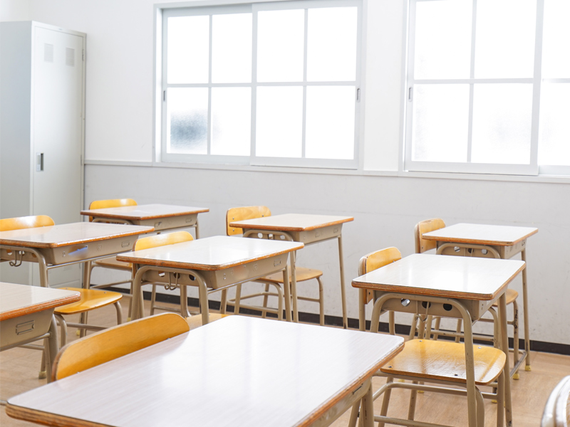 desks and chairs in empty classroom