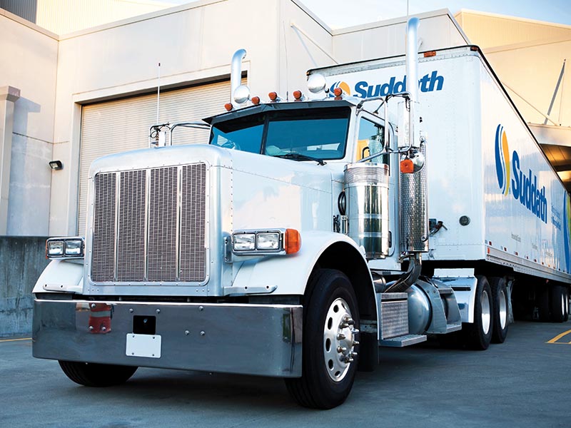 docked suddath truck at logistics warehouse