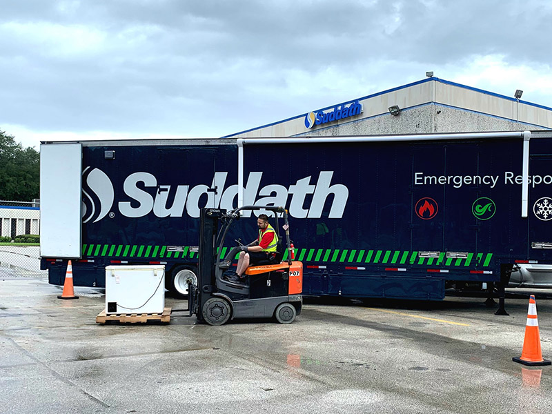 employee adding items to the suddath emergency response unit