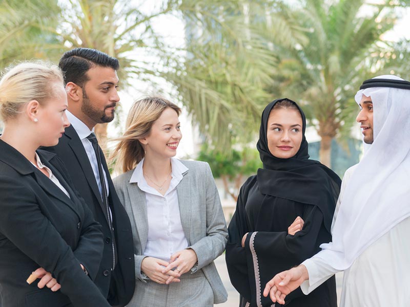 men and women at international business meeting