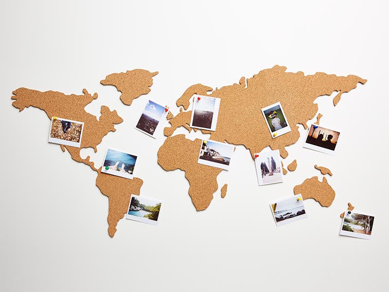 international map with photos on wall