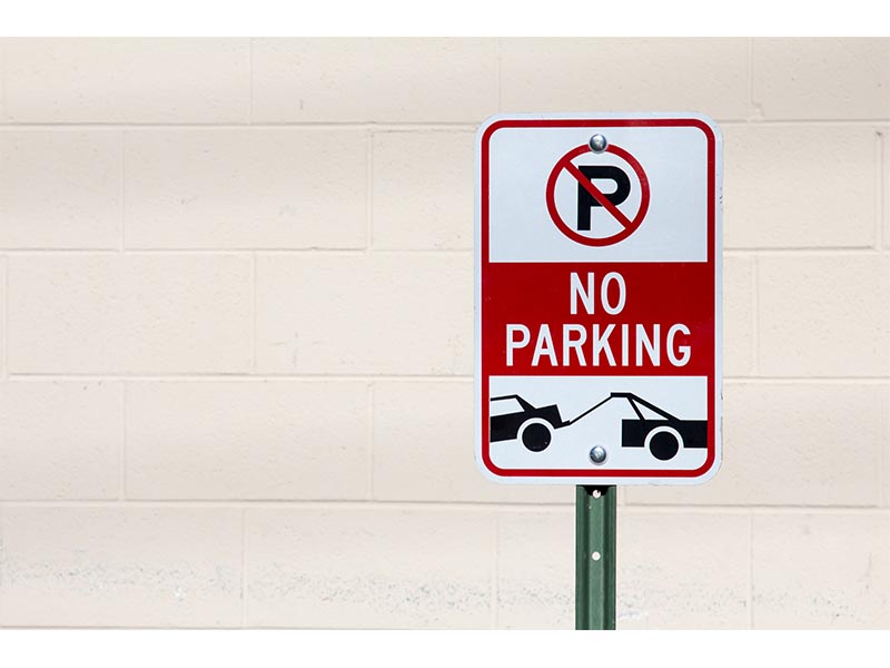 no parking tow away zone sign