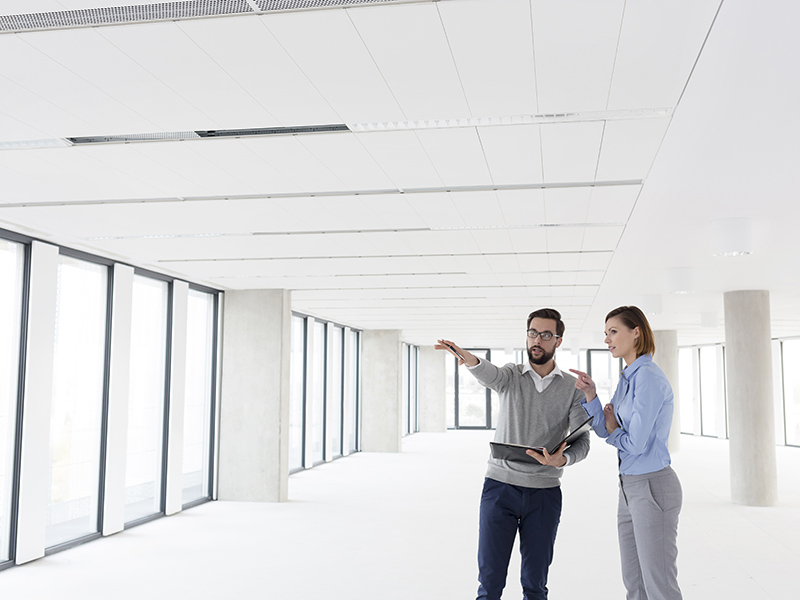 man and woman discussing office move plan