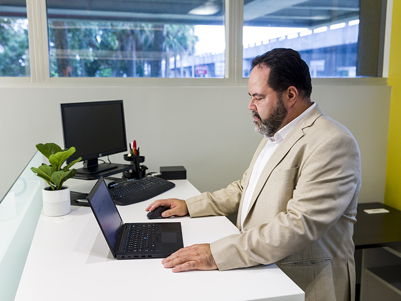 employee using office moving technology on laptop