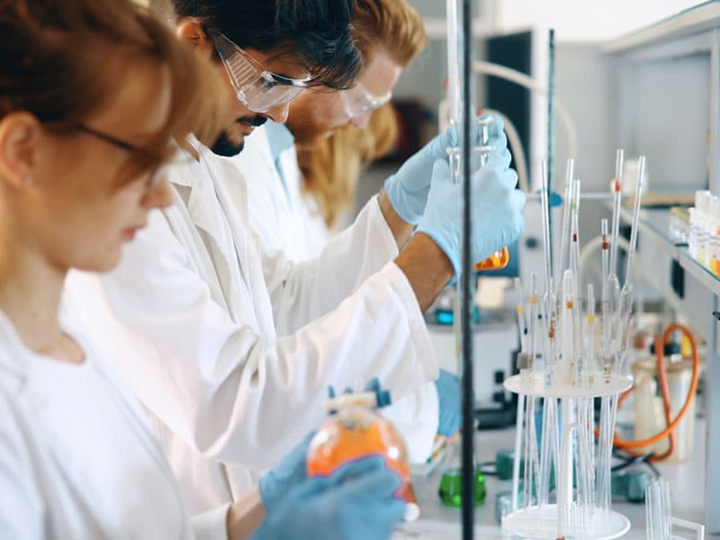 older students working lab