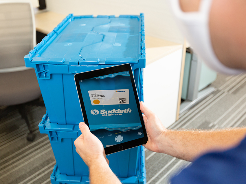 office mover using tablet to scan computer