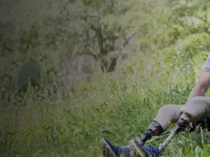 Veteran with service dog and prosthetic legs
